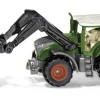 Tracteur avec chargeur et pince à balles